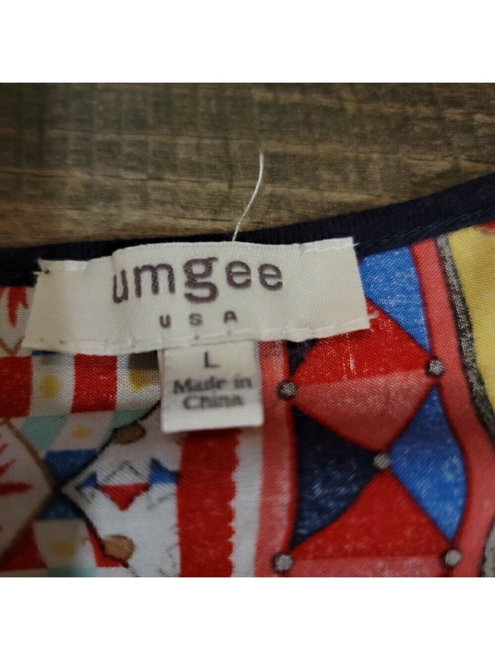 Umgee Mixed Material Navy and print fabric top with cap sleeves and scoop neck. - Picture 3 of 3